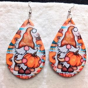 Teardrop painted fall gnome with pumpkin earrings.